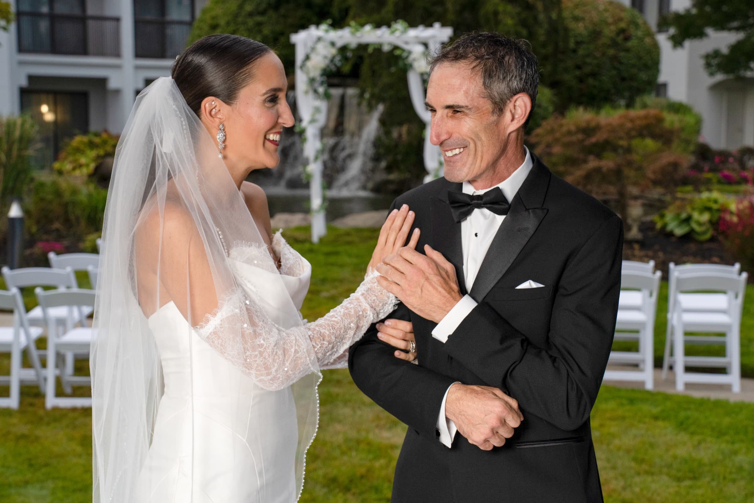 Bride and groom at a garden ceremony at the Falls